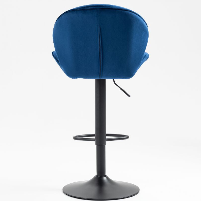 Adjustable blue velvet bar stools in modern kitchen setting