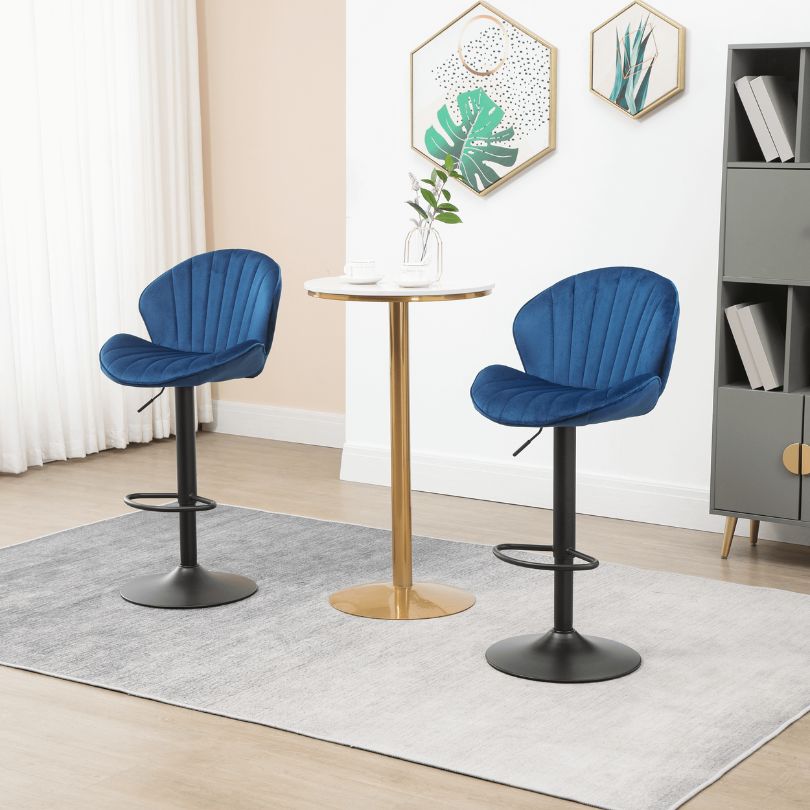 Adjustable blue velvet bar stools in modern kitchen setting