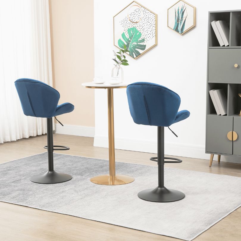 Stylish blue velvet bar stools showcasing adjustable base functionality
