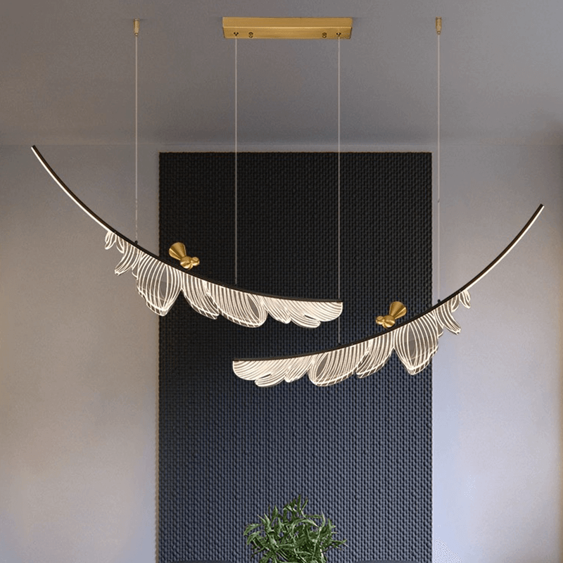 Elegant bronze feather pendant chandelier in a stylish living room.