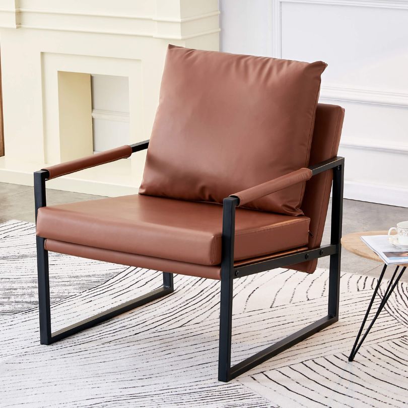 Chic brown PU leather chair with metal frame from the side, showcasing its sleek design.
