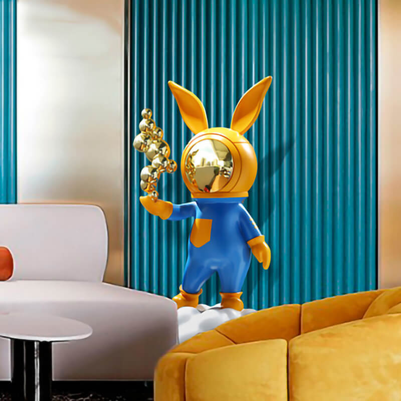 Modern rabbit resin statue showcasing vibrant colors on a shelf.