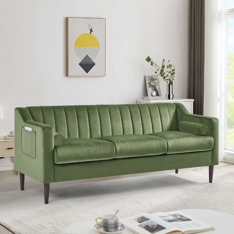 Side view of the luxurious green velvet Chesterfield sofa showcasing its elegant design and storage pocket.