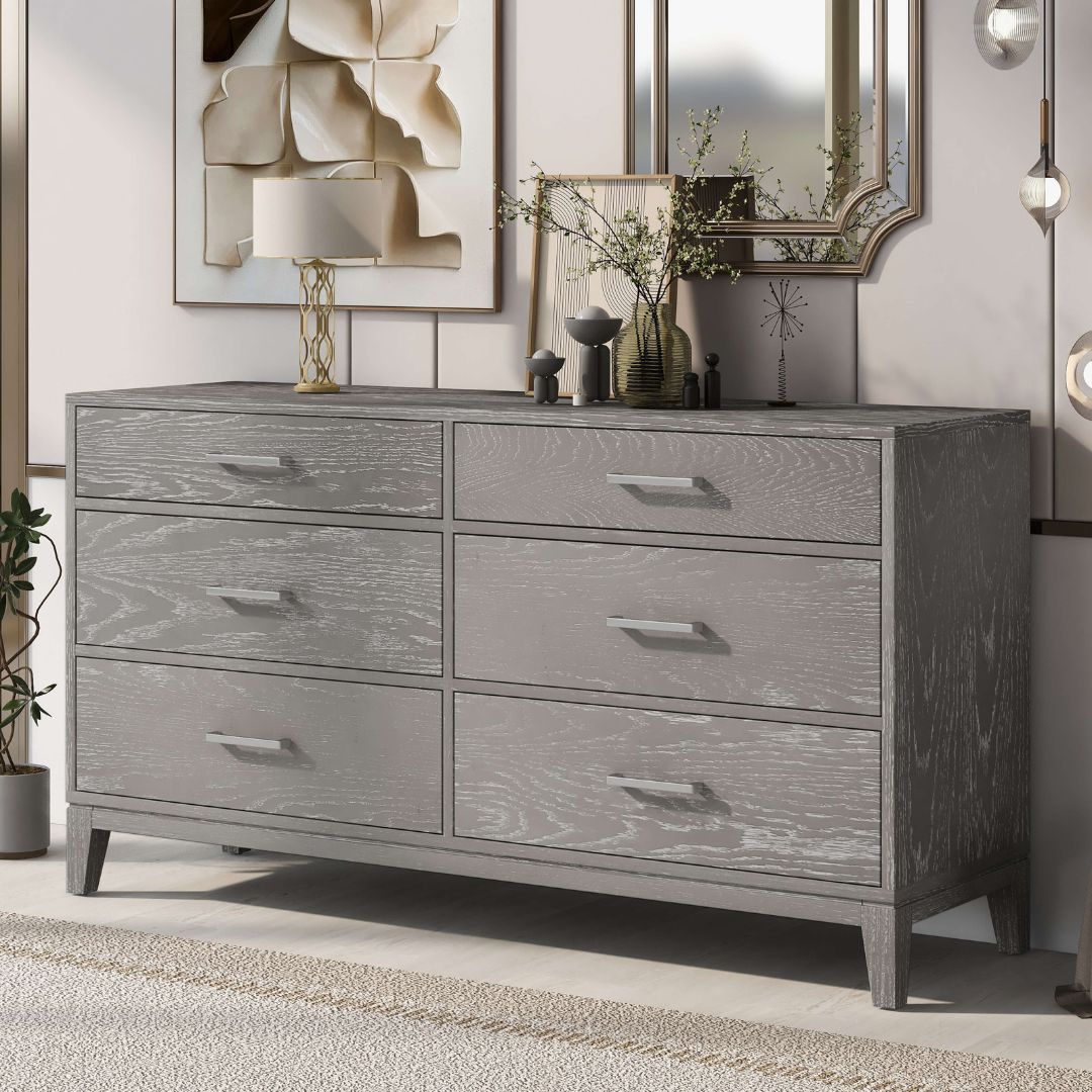 Close-up of the smooth-gliding drawers of the gray wood dresser highlighting storage space.