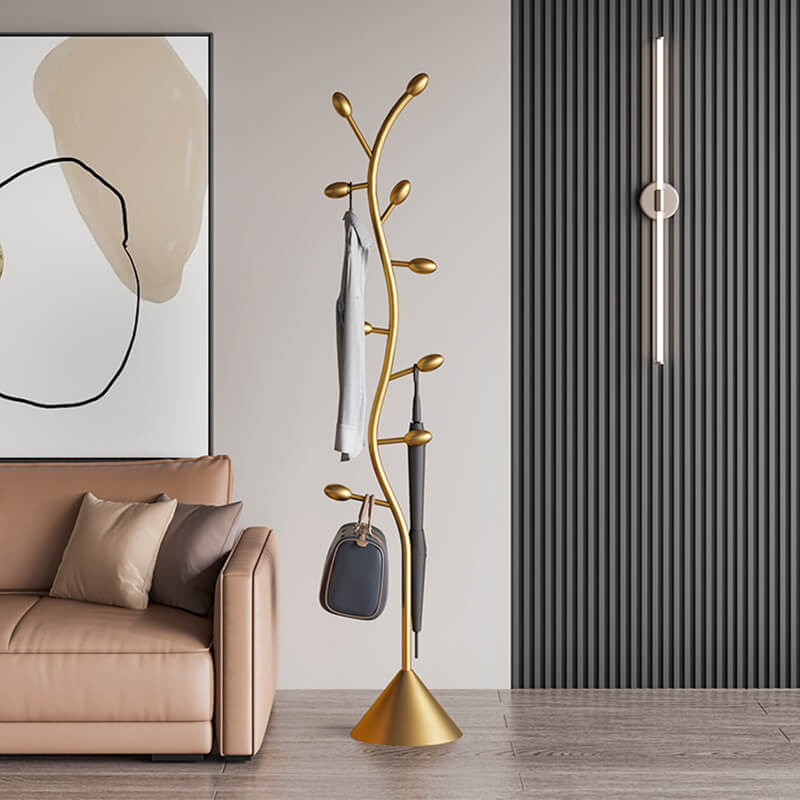 Gold Spiral Abstract Coat Rack showcasing its elegant design and functionality in a stylish entryway.