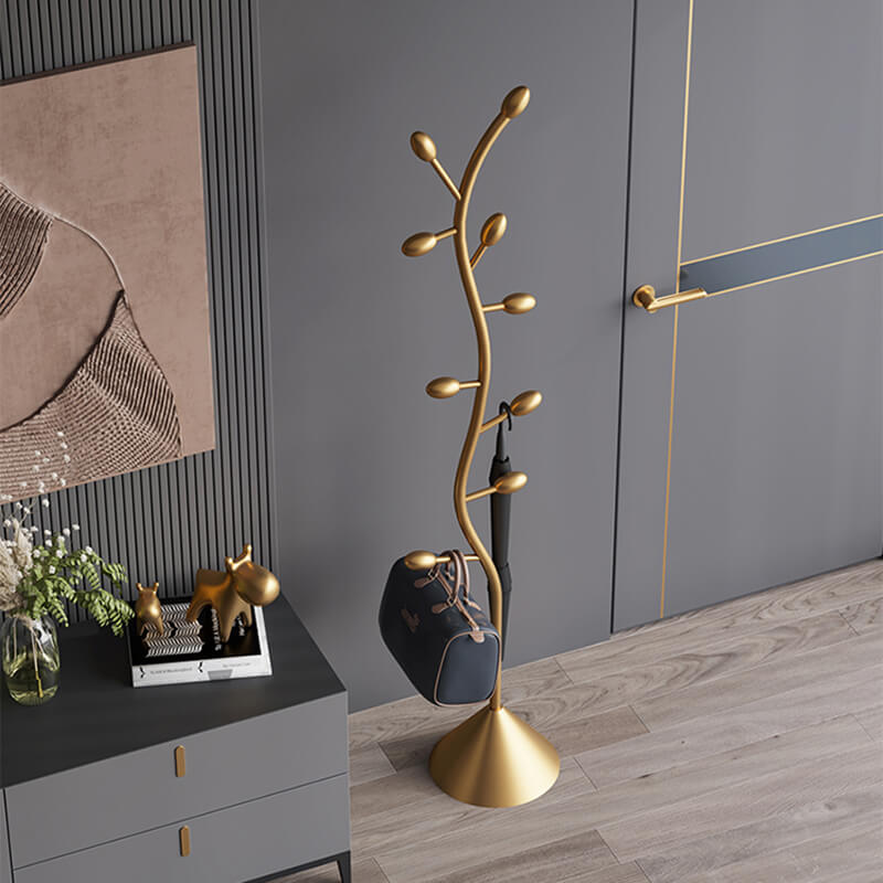 Gold Spiral Abstract Coat Rack showcasing its elegant design and functionality in a stylish entryway.