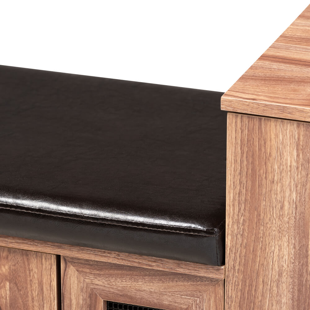Shoe bench in entryway setting holding boots, bags, and decorative items