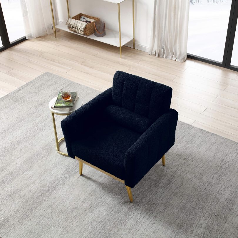 Close-up view of the plush teddy fabric on the dark blue accent chair, highlighting its comfort.