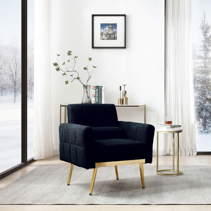 Cozy setup featuring the dark blue teddy armchair with a waist pillow in a modern living room.