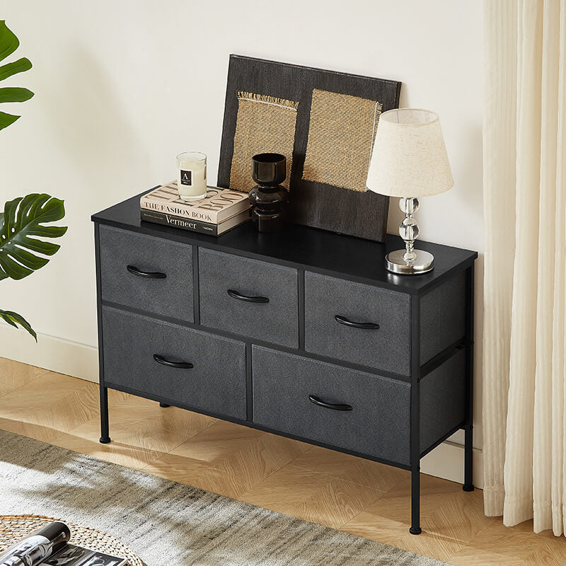 Close-up of the easy-pull handles on the modern dark gray dresser.