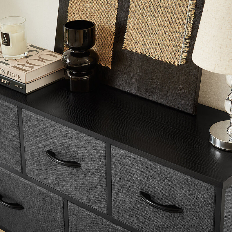 Stylish dresser used as a TV stand in a cozy living room setting.