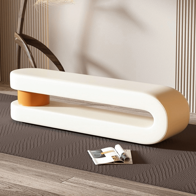 Close-up of the luxury upholstered leather bench with a unique c-shape design.