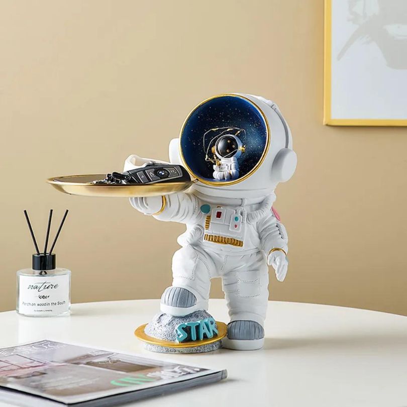 Close-up view of the astronaut decorative tray, perfect for organizing small trinkets.