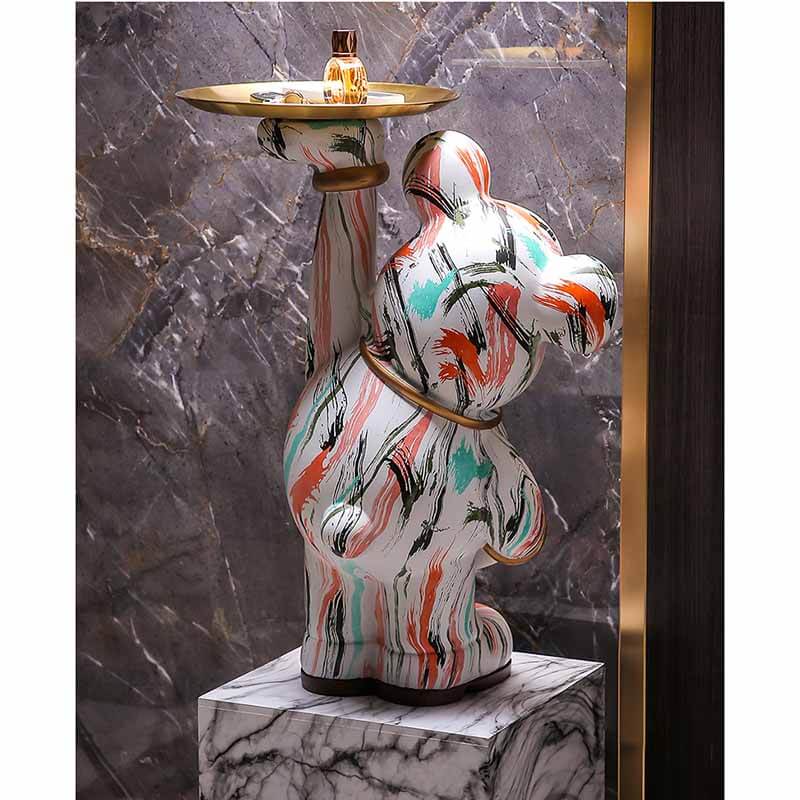 Angled view of vibrant graffiti bear sculpture showcasing colorful design.