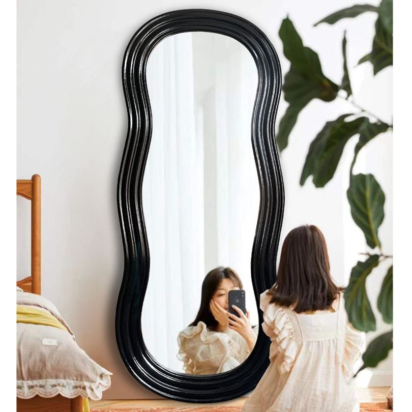 Close-up of the expertly crafted bevel cuts on the decorative mirror.