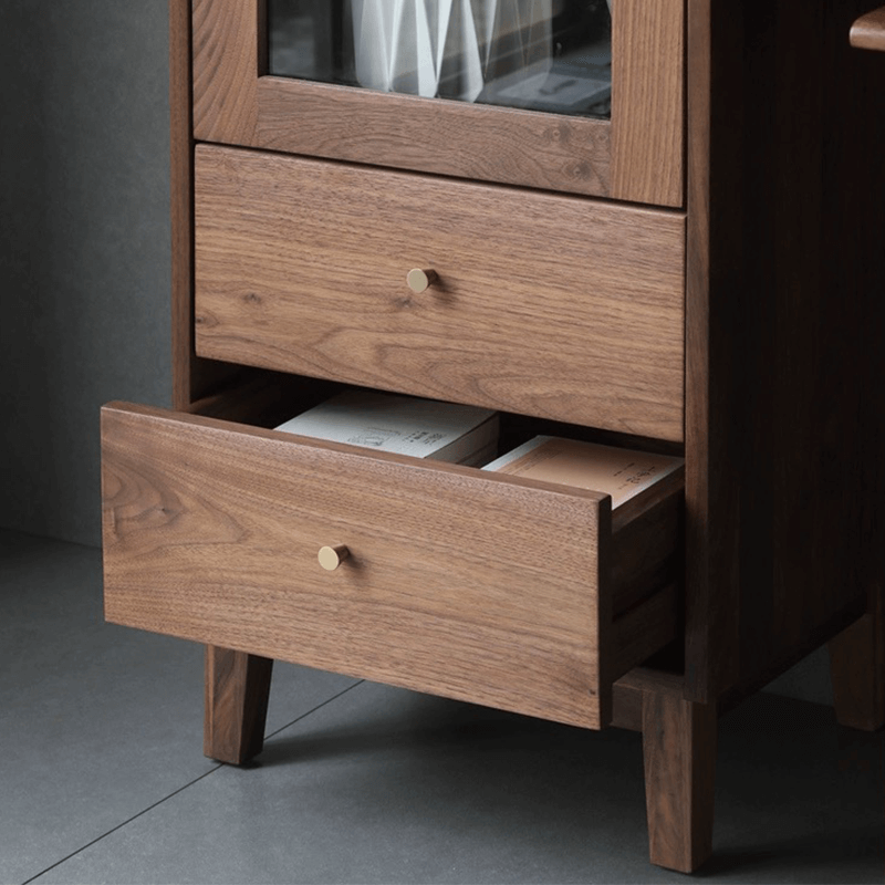 Close-up of the cabinets sleek walnut finish and glass shelves.