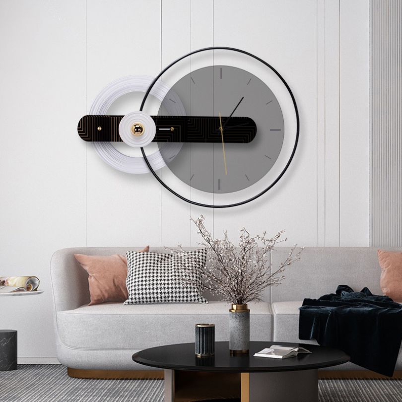 Close-up of the round glass wall clock showcasing its sleek design and bold numerals.
