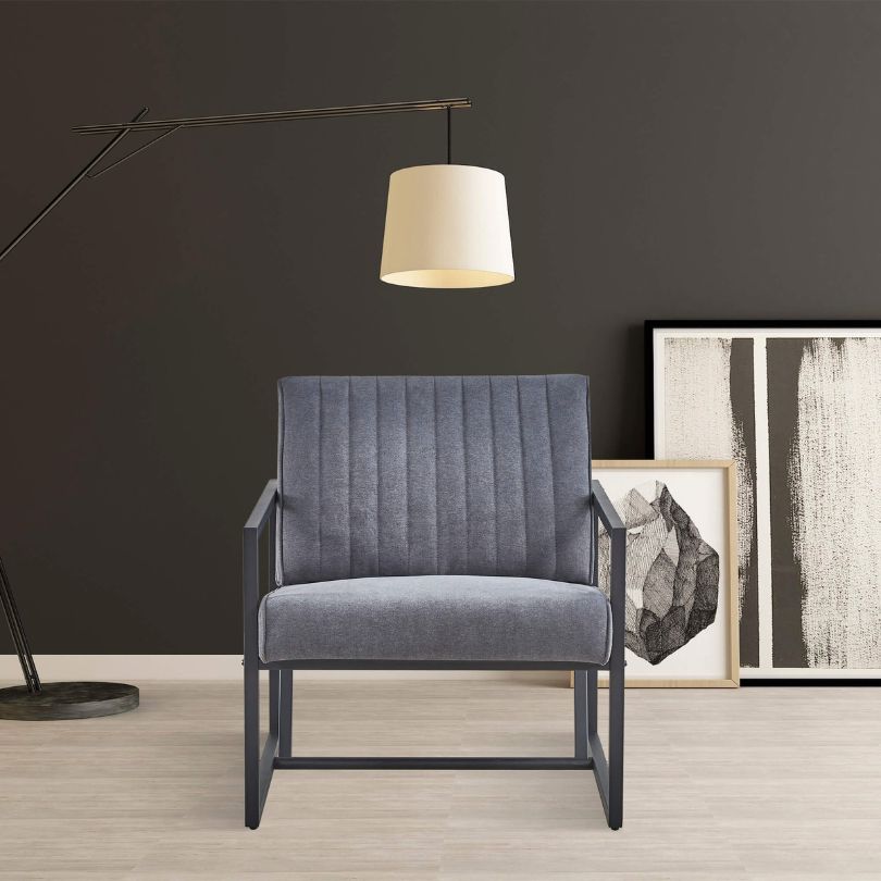 Close-up of grey accent chair’s plush velvet texture and stitching details