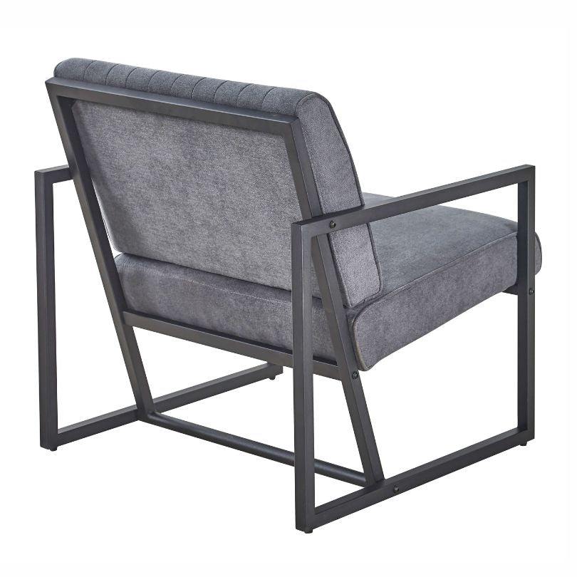 Close-up of grey accent chair’s plush velvet texture and stitching details