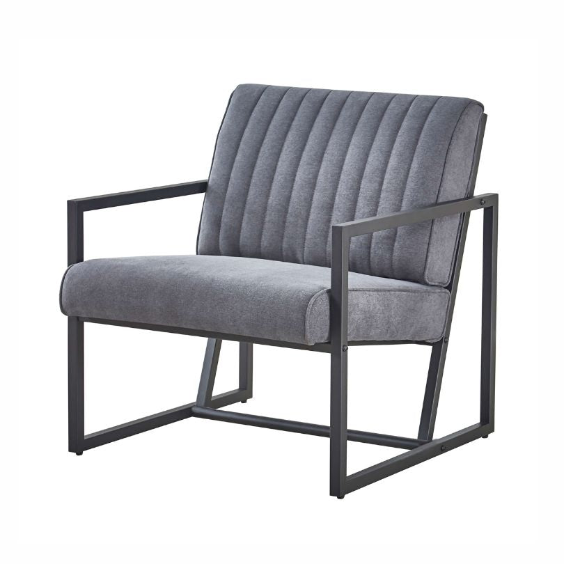 Steel armchair styled in living room setup with soft lighting and neutral decor