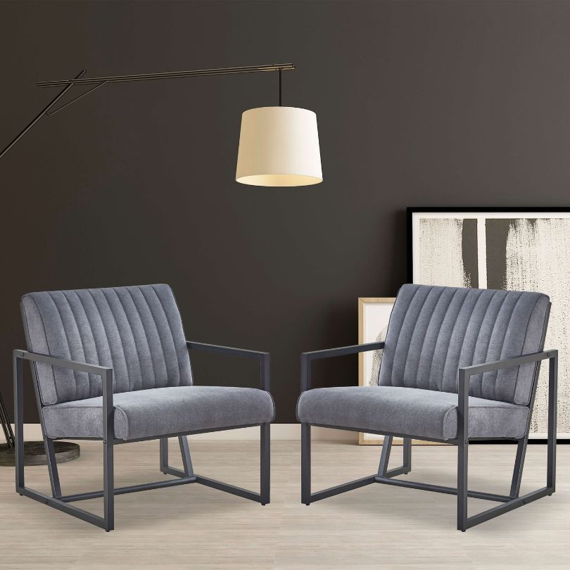 Angled view of modern armchair highlighting velvet cushion and steel legs
