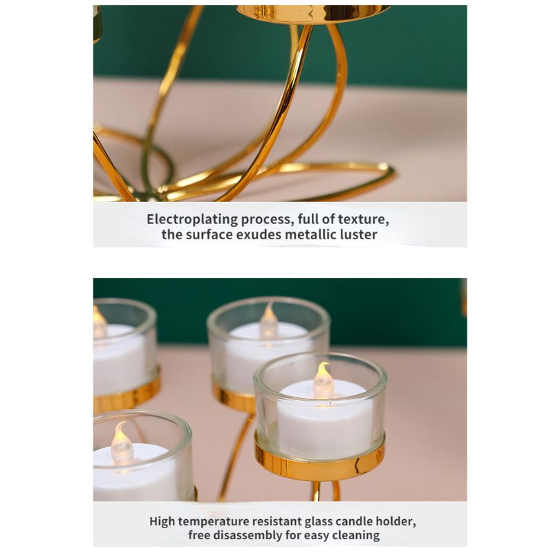 Elegant gold candle holder showcasing the warm glow of a stick candle on a dining table.