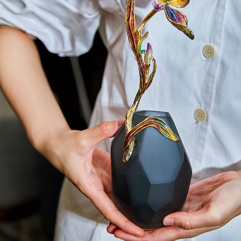 Elegant modern enamel glass vase showcasing black enamel finish, perfect for living room decor.
