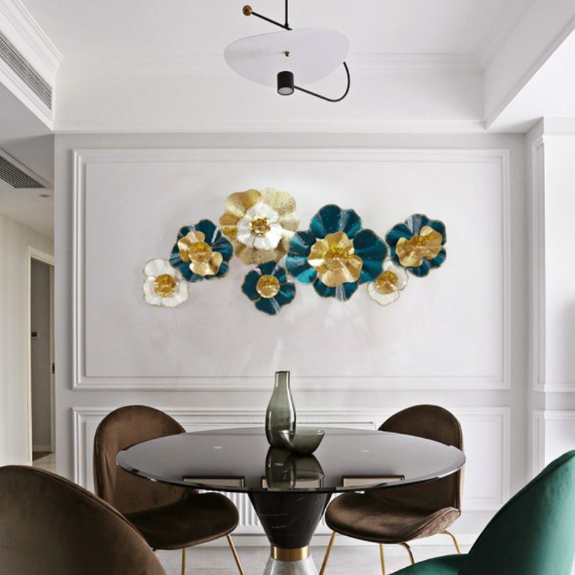 Stunning modern metal flower wall art displayed in a living room setting.