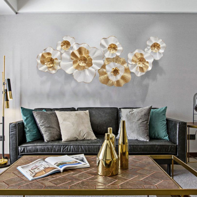 Stunning modern metal flower wall art displayed in a living room setting.
