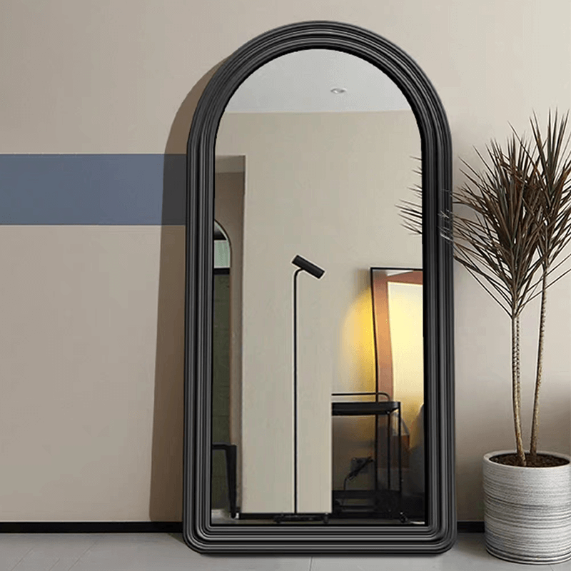 Elegant black arched frame full length wall mirror showcasing its sleek design.
