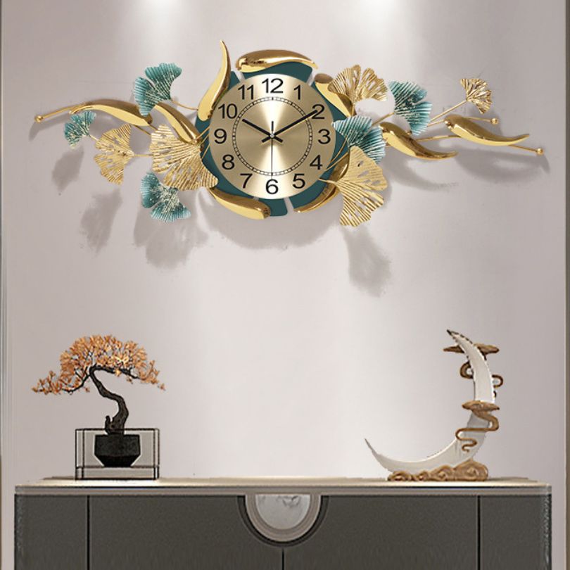 The ginkgo leaf wall clock displayed in a beautifully decorated living room.