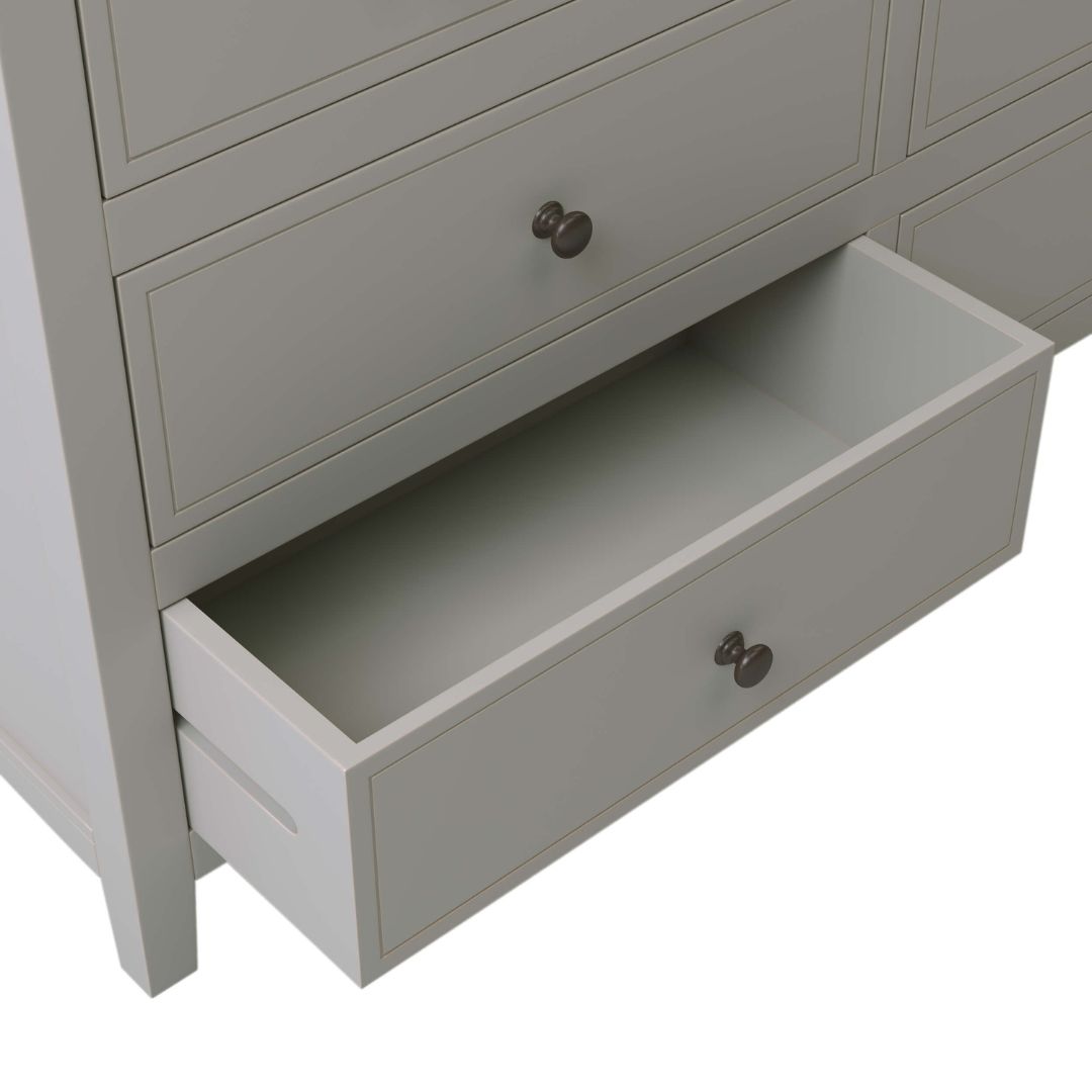 Close-up of the chic metal knobs on the gray solid wood dressers drawers.