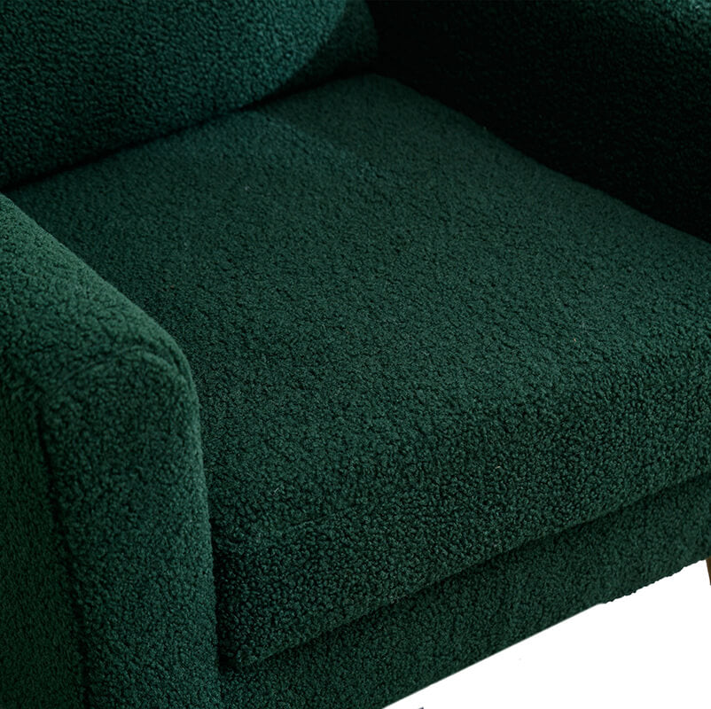 Chic green boucle accent chair from the side, showcasing its modern design.