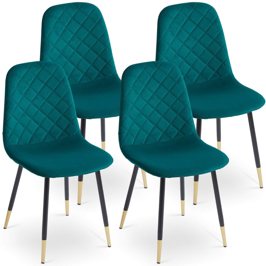 Elegant green velvet dining chair set displayed in a modern dining room.