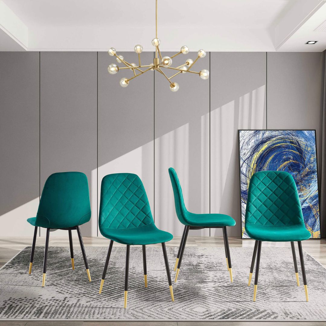 Close-up of tufted upholstery on a stylish green velvet dining chair.