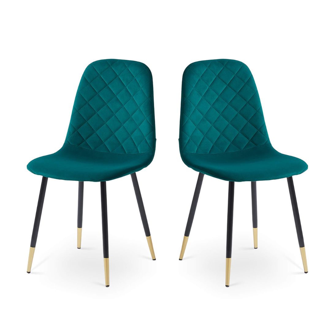 Two-piece green velvet dining chair set in a cozy dining environment.