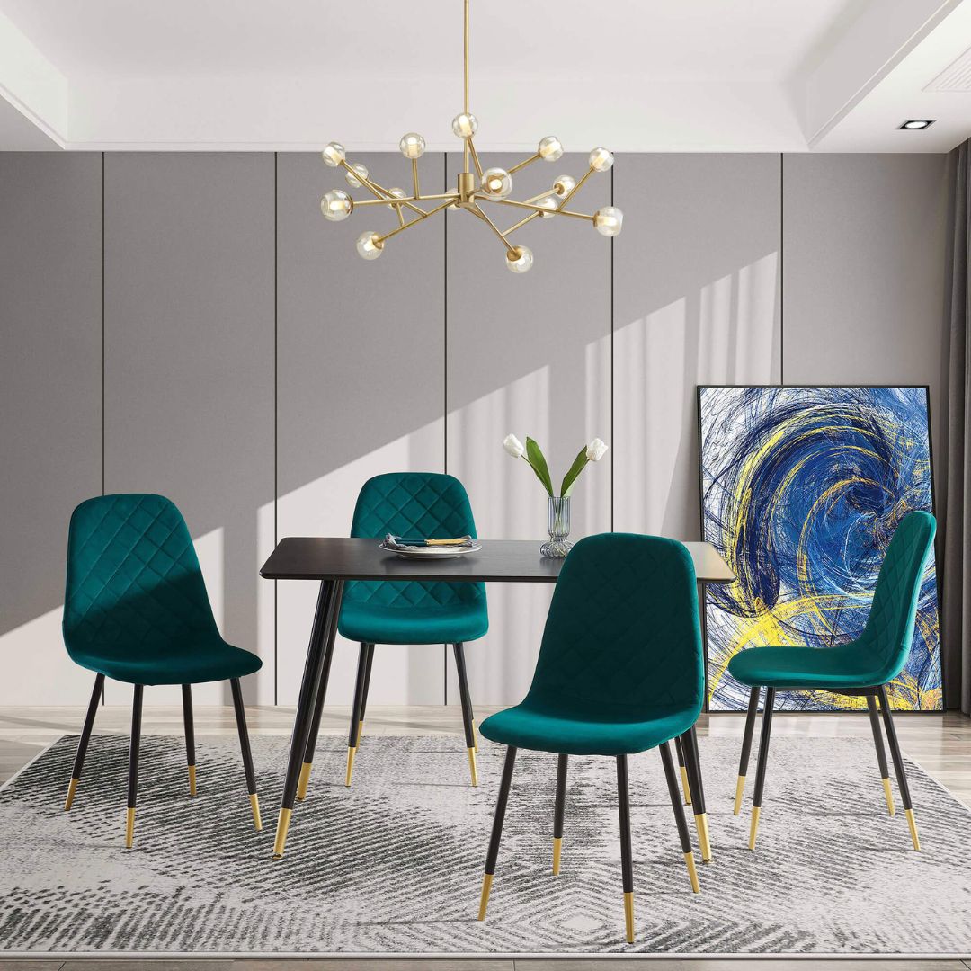 Elegant green velvet dining chair set displayed in a modern dining room.