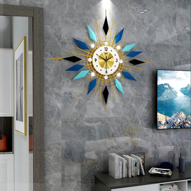 Front view of GeoAura modern clock showing geometric design and bold blue-gold finish