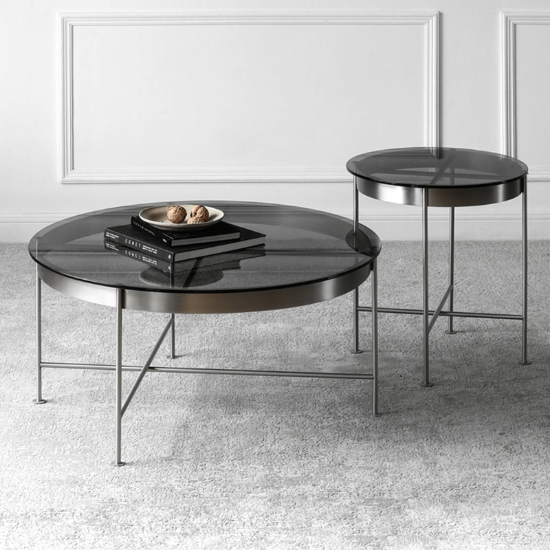 Stylish living room setup featuring the elegant round glass coffee table in black.