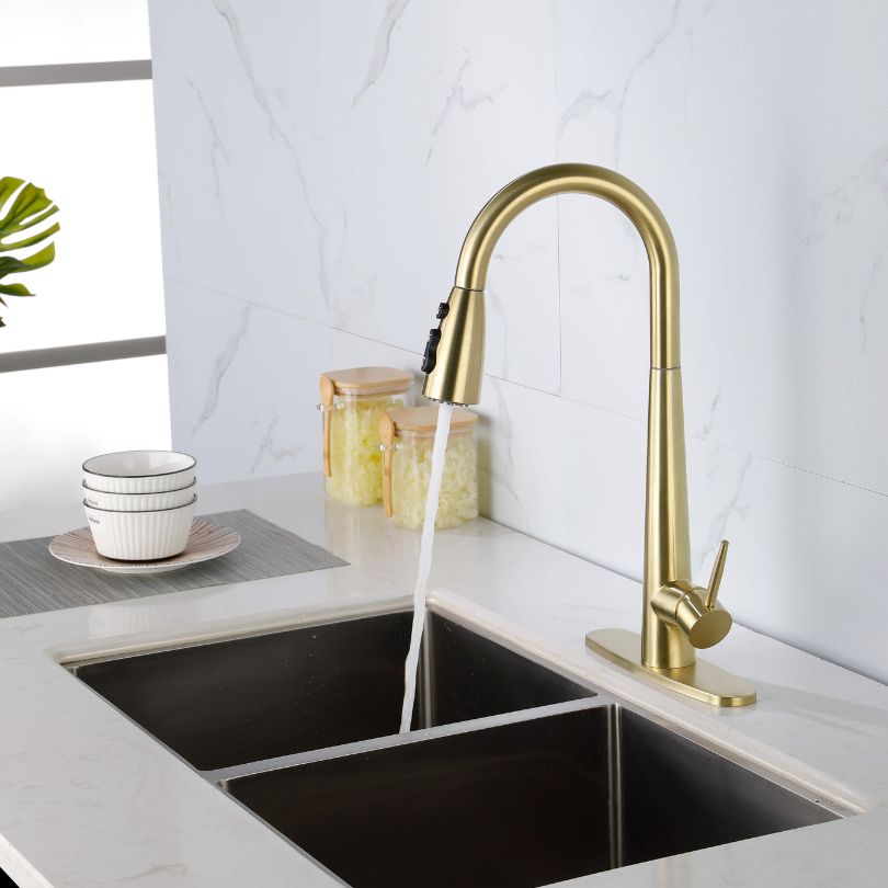 High arc modern kitchen faucet installed above a stylish sink, demonstrating functionality.
