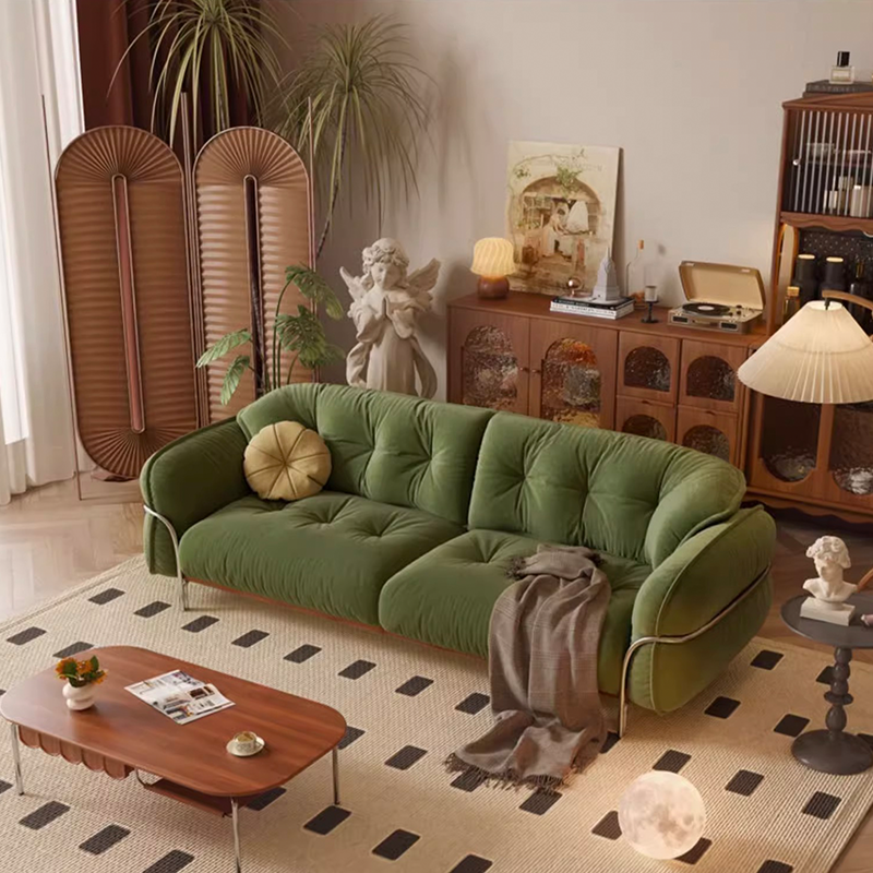 Close-up of the tufted design on the upholstered sofa showcasing its fabric quality.