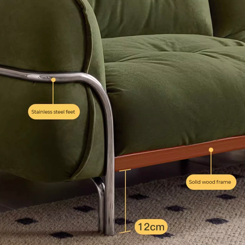 Close-up of the tufted design on the upholstered sofa showcasing its fabric quality.