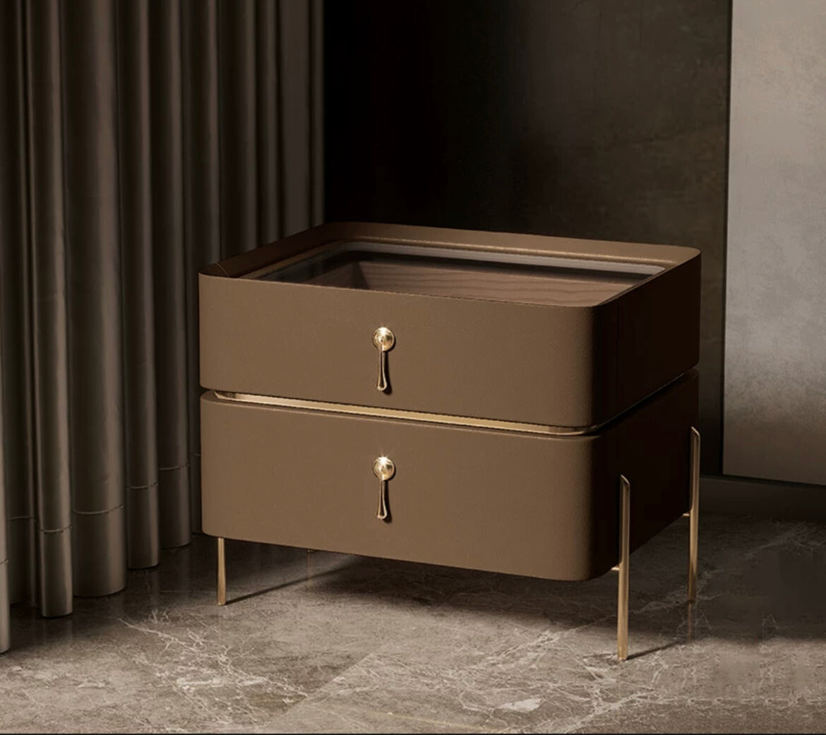 Close-up of the gold accents and drawer details on the modern bedside table.