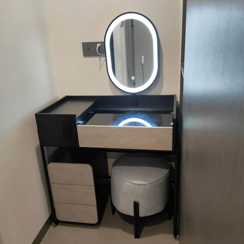 Modern makeup desk with drawers and mirror, showcasing spacious storage in a bedroom.