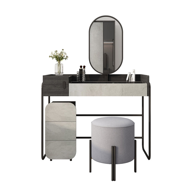 Modern makeup desk with drawers and mirror, showcasing spacious storage in a bedroom.