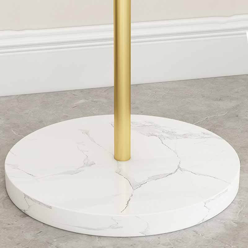 Close-up view of the metal coat stand, highlighting its gold finish and sturdy construction.