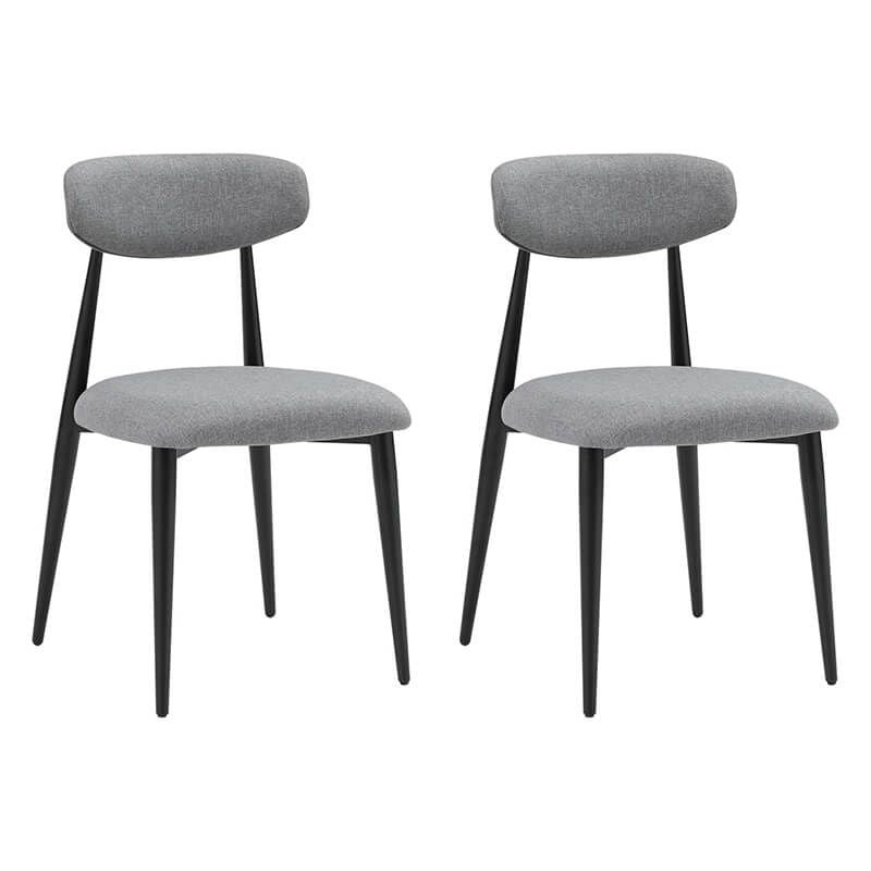 Set of two modern grey dining chairs arranged around a stylish dining table, enhancing the décor.
