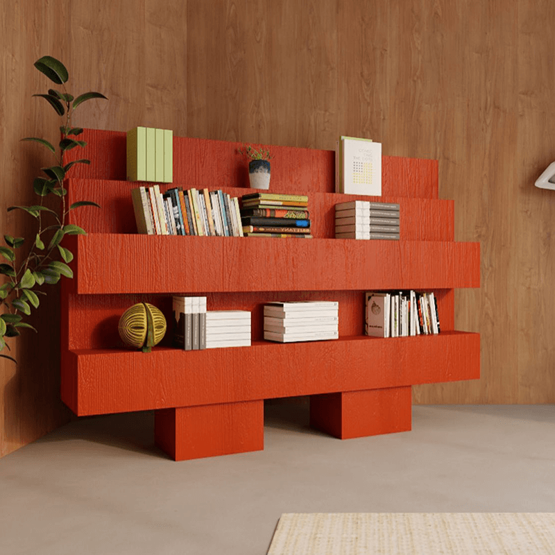 Sleek red minimalist bookcase in a living room setting with books arranged neatly.