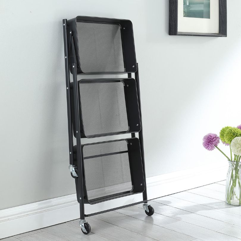 Sleek black rolling kitchen storage cart showcasing its mesh tray and sturdy wheels.