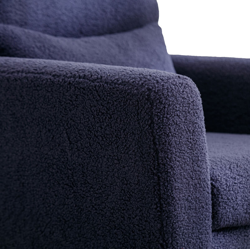 Navy boucle accent chair showcasing its plush fabric and gold metal legs from the side